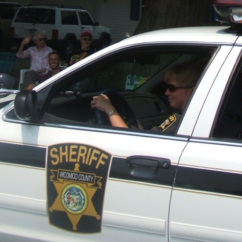 Sheriff candidate and current second-in-command Doris Schonbrunner paces the parade.